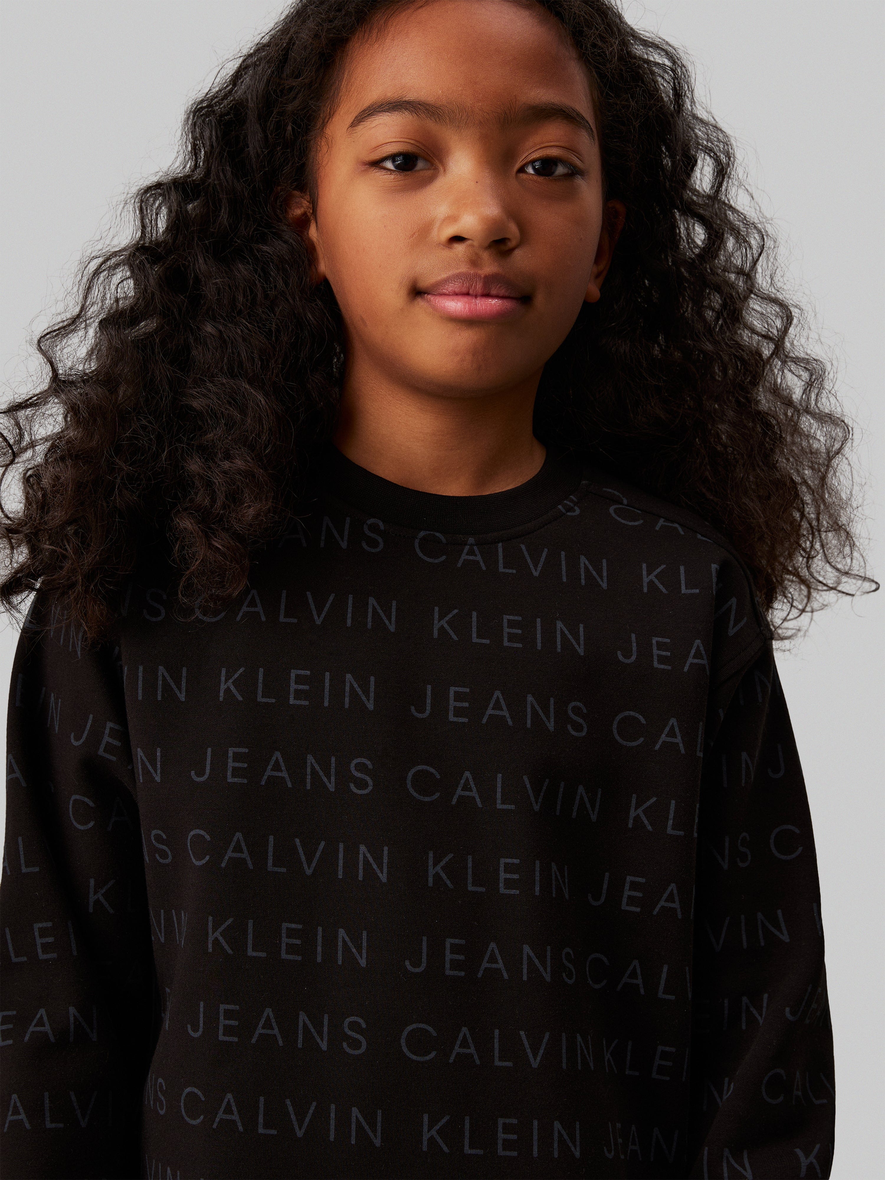 Calvin Klein Girls Logo AOP Fleece Dress in Black