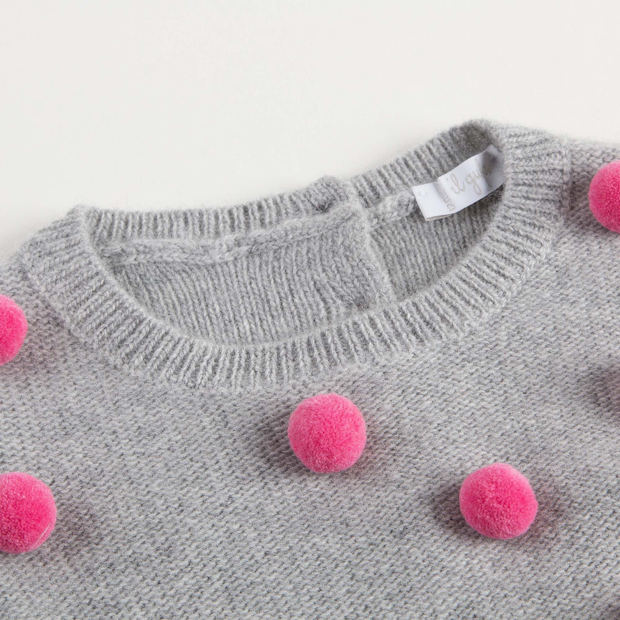 Robe tricotée en laine grise pour bébé fille avec pompons