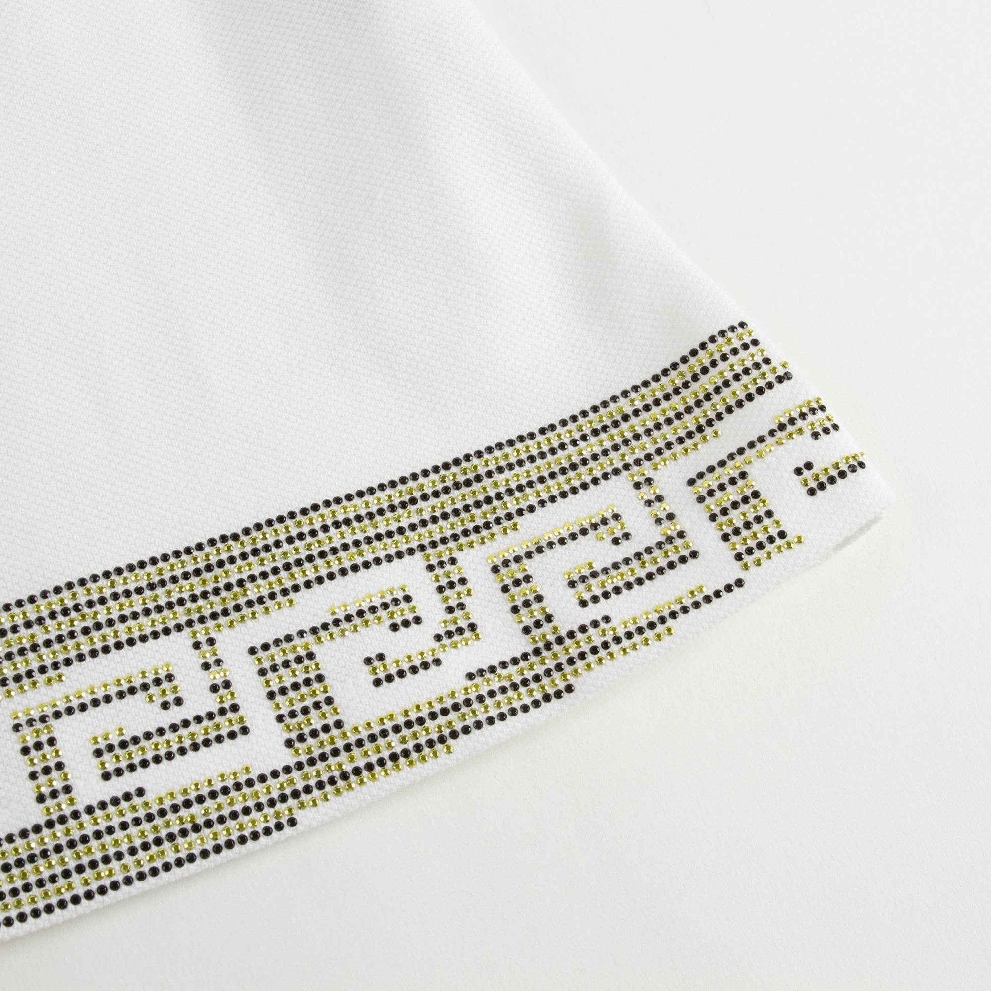 Robe bébé fille en coton blanc avec bordures en strass dorés